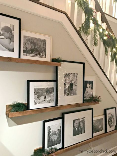 Oct 23, 2020 - A nighttime tour of our Christmas home -- including the porch, foyer, family room, staircase and dining room. Above Couch Wall Decor Transitional, Decorating Industrial Shelves, Landing Photo Wall, Stairwell Decorating Ideas, Stair Wall Decorating Ideas, Stairwell Ideas, تحت الدرج, Hall Stairs, Displaying Photos