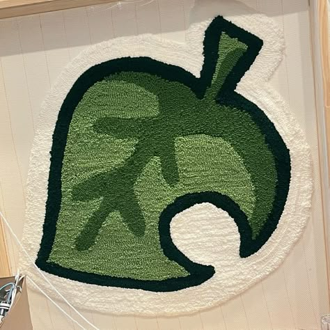 My latest creation for my dear friend Izik (who doesn’t have insta). They requested the Animal Crossing logo leaf with specific greens to match their room! #animalcrossing #rugmaking #wallrug #tufting Animal Crossing Logo, Tufted Rug Design, Animal Crossing Leaf, Leaf Rug, Tufting Ideas, Funky Rugs, Rug Tufting, Punch Needle Rug, Rug Designs