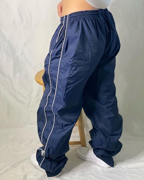 SOLD😗 Navy blue NIKE windbreaker pants Size XLarge (It has an adjustable string on the inside to fit smaller!) Flaw: it has a faded spot… | Instagram Nike Windbreaker Pants, Swishy Pants, Track Pants Outfit, Navy Blue Nike, Windbreaker Pants, Nylon Pants, Side Design, Nike Windbreaker, Blue Nike