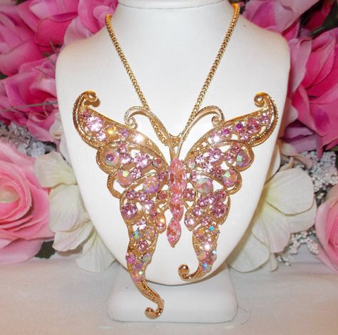 Betsey johnson beautiful large pink crystal inlay butterfly long gold plated chain necklace.  the pendant measures 3.3 " by 3 " and is inlaid with beautiful sparkling crystals.  the long gold plated chain is 24 " and has a 2 " extension with a signed heart in place.  lovely to wear, add to a collection or to be gifted. Pink Crystal Glamorous Necklace, 2000s Accessories, Luxury Pink Butterfly Jewelry, Exquisite Pink Pendant Necklace, Whimsical Pink Butterfly Jewelry, Angel Wings Necklace Betsey Johnson, Dope Jewelry Accessories, Dr Shoes, Betsey Johnson Jewelry