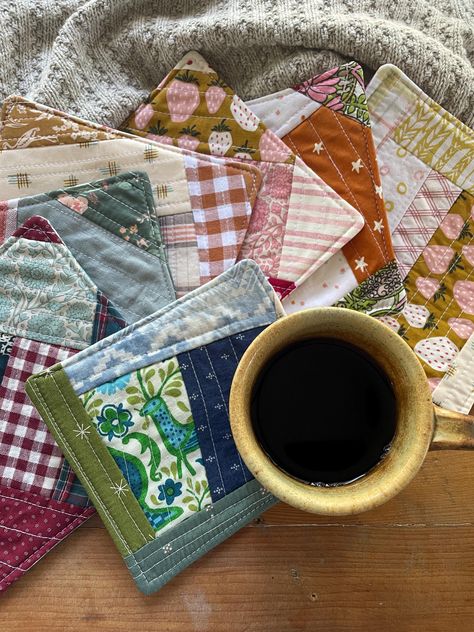 A small little pretty to help start your day with your favorite coffee. Or a special little gift for that sweet friend you share conversations with over coffee. These one of a kind pretties are made from treasured scrap fabrics. They can be used on either side-a quilted design on one and colorful coordinating prints on the reverse. They have a thick batting center for absorbency.  Each mug rug measures between 5-7 inches square . Pick your design in the drop down menu on the right.  Each photo s Quilted Mug Rug Patterns Free, Coffee Quilt, Small Quilted Gifts, Quilt Placemats, Quilted Mug Rugs, Mug Rug Tutorial, Quilted Coasters, Mug Rug Patterns, Rug Patterns