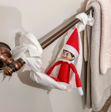 "Elf On The Shelf idea with an elf sitting in a hammock made from a roll of toilet paper hanging on a towel bar in the bathroom." Elf Hammock, Funny Elf On The Shelf, Elf On The Shelf Idea, Elf On Shelf, Elf Funny, Xmas Elf, Elf Antics, Elf On The Shelf Ideas, An Elf