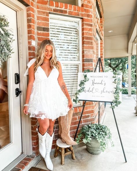 Bridal Shower 7.13.2024 - Boots & Bubbly 👢🫧 • Dress - @selfie_leslie Boots - @willowchicboutique Necklace - @smilebelleofficial • #bridalshower #bridalshowerideas #bridalshowerdress #bride #bridestyle #bridesofinstagram #dfw #dallastexas #trending #trendingnow #viral #fyp #explorepage✨ #cuteoutfits #summerdress #whitedress #bootsandbubbly Wedding Dress And White Boots, Bridal Shower Outfit For Bride Western, Cowgirl Wedding Reception Outfit, After Wedding Bride Outfit, Wedding Reception Dress For Bride Country Cowgirl Boots, Short Wedding Dress With Cowgirl Boots, Reception Dress Country, Western Wedding Dresses Short, Short Wedding Dress Cowboy Boots