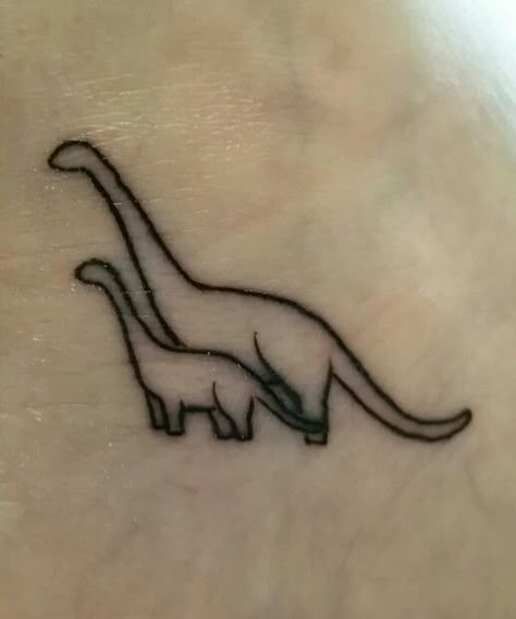 Aww reminds me of Little Foot from The Land Before Time Mother Son Dinosaur Tattoo, Mother Daughter Dinosaur Tattoos, Little Foot Tattoos Land Before Time, Ezra Tattoo, Small Dinosaur Tattoo, Land Before Time Tattoo, Mother Son Tattoo, Mother And Son Tattoo Ideas, Tattoo Mother Daughter