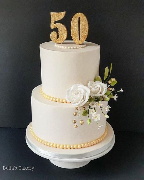 A cake to celebrate a milestone birthday. Numerical cake topper and sugar flowers made out of fondant. 20 Year Anniversary Cake, 50 Th Wedding Anniversary Cakes, Gorgeous Cakes Birthday, Cake For 50th Birthday For Women, 50th Anniversary Cakes Simple, 50th Cake For Women, 50 Th Birthday Cake, 50 Anniversary Cake, 50th Birthday Cakes