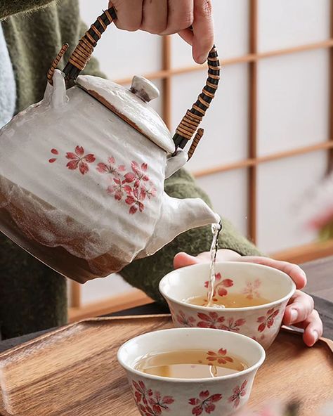 This handcrafted Japanese tea set brings the beauty of cherry blossoms into your home. With soft pink sakura petals delicately painted on rustic, earthy ceramics, it evokes the gentle flow of seasons and the warmth of tradition. The sturdy bamboo-wrapped handle adds a touch of craftsmanship, making each tea ritual feel special and authentic. Whether you're sharing tea with loved ones or enjoying a peaceful moment alone, this set offers a perfect blend of artistry and function. #mino__craft#m... Sakura Petals, Earthy Ceramics, Japanese Tea Set, Pink Sakura, Tea Ritual, Tea Rituals, Japanese Tea, Feel Special, Feeling Special