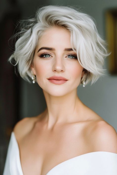 Looking for bridal hair ideas for short hair you can DIY? These 30+ styles range from simple to intricate, perfect for brides on a budget. Explore now! #diybride #weddinghairideas #shorthair Wedding Hair For A Bob, Chin Length Hair Wedding, Bride With A Bob, Bob Hair Bride, Wedding Hair For Short Bob, Pixie Bridal Hairstyles, Short Hair Waves Wedding, Wedding Dress Short Hair, Bridal Hair Short Bob