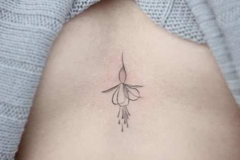 Fine Line Fuchsia Flower Tattoo Fuschia Tattoo, Fuchsia Tattoo, Flower Fairy Tattoo, Realistic Flower Tattoo, Flower Spine Tattoos, Piercing Inspiration, Orchid Tattoo, Fuchsia Flower, Full Back Tattoos