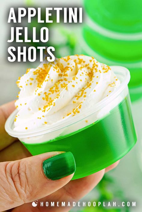 Appletini Jello Shots! Just like the popular cocktail, these vibrant green appletini jello shots are infused with delicious apple and citrus flavors and topped with whipped cream. | HomemadeHooplah.com Green And Gold Jello Shots, Green Apple Jello Shots, Pinterest Food Recipes, Crown Apple, Pinterest Food, Popular Cocktails, Jello Shots, Ladies Night, Adult Beverages