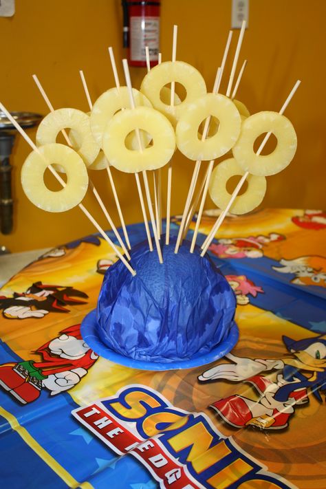 Pineapple slices represent Sonic's rings for the Hedgehog fan in your family! Sonic Fruit Tray, Sonic The Hedgehog Pool Party, Sonic Games Birthday Parties, Sonic The Hedgehog Party Games, Sonic Food Ideas, Sonic Party Food Ideas, Sonic Birthday Party Games, Sonic The Hedgehog Birthday Party Games, Sonic The Hedgehog Birthday Party Ideas