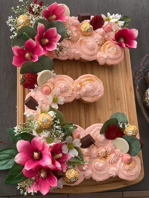 Letter Pull Apart Cupcakes, Pull Apart Cupcake Cake Letters, Letter Cupcakes Ideas, Fall Baby Shower Cupcakes Girl, Baby Shower Cupcake Cakes Pull Apart, Boho Baby Shower Cupcakes Girl, Baby Shower Pull Apart Cupcakes, Letter Cupcake Cake Pull Apart, Wildflower Baby Shower Cake