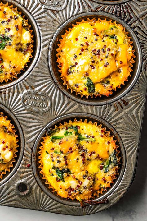 These crustless quiche muffins are savory, cheesy egg muffins baked in a muffin tin! Make them for a light breakfast, lunch, or easy snack! #quiche #muffins #breakfast Muffin Tin Crustless Quiche, Quiche Muffins Crustless, Muffin Egg Breakfast, Egg Frittata Recipes Muffin Tins, Muffin Quiche Recipes, Mini Quiches In Muffin Tin Crustless, Savory Muffins Breakfast, Mini Quiches In Muffin Tin, Baked Eggs In Muffin Tin