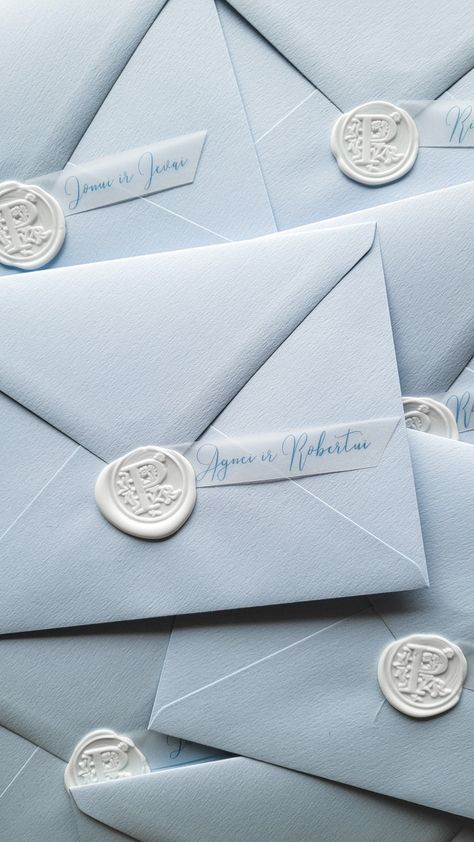 Pile of pastel blue envelopes with white wax seal stamp Blue Wedding Envelopes, Dusty Blue Envelope, White Wax Seal, Packaging Aesthetic, Pastel Blue Wedding, Wax Seal Wedding, Fairytale Wedding Theme, Blue Envelope, Wedding Invitation Inspiration