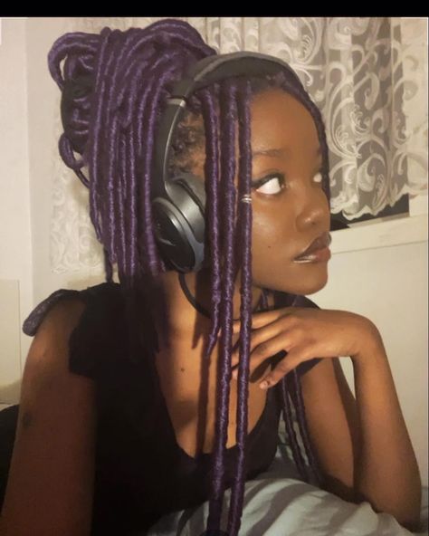 alt gothic black girl side profile purple faux locs messy bun Black And Purple Locs Black Women, Colored Braids Aesthetic, Black And Purple Faux Locs, Purple Dreadlocks Black Women, Faux Locs Side Part, Purple Faux Locs Black Women, Black Woman With Purple Hair, Black Women Purple Hair, Dreads Side Profile