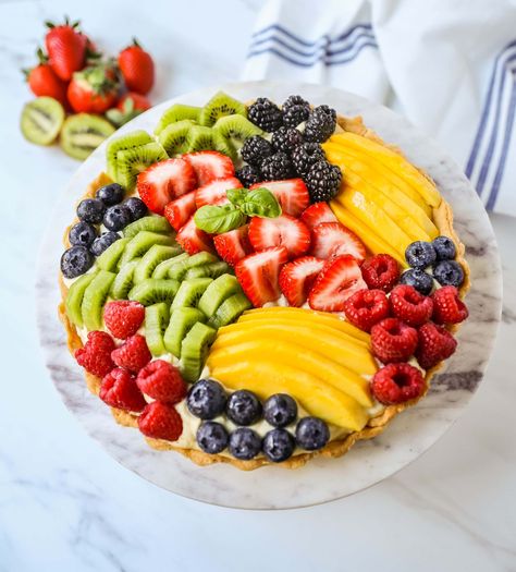 Fruit Tart with Pastry Cream This French fruit tart is made with a flaky, buttery pie crust, filled with homemade vanilla bean pastry cream, and topped with fresh fruit. Tart With Pastry Cream, Fruit Tart Crust, French Fruit Tart, Vanilla Pastry Cream, Fresh Fruit Tart, Buttery Pie Crust, Tarts Crust, Pastry Cream, Fruit Tart