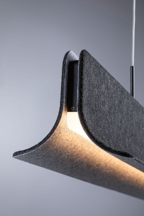 The height-adjustable LED pendant luminaire Noyan, made of felt in Anthracite with 3400lm / 3400lm, not only stands out for its simple modern design, but also creates a pleasant atmosphere while reducing disruptive background noise. What’s more, it’s made of sustainable, recycled material. Its high light output makes the pendant luminaire perfect for lighting dining or meeting tables. The warm colour temperature creates a cosy ambiance for relaxing moments at home. The luminaire can be dimmed in Felt Lamp, Bathroom Lighting Trends, Minimalist Ceiling Light, Architectural Lighting Design, Recessed Spotlights, Led Light Design, Led Band, Relaxing Moments, Bollard Lighting