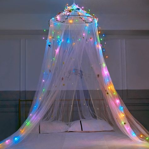 PRICES MAY VARY. Princess Bed Canopy -- Our girls canopy is dotted with glow-in-the-dark stars and LED lights(Battery not included), which illuminates the bedroom. It will looks more dreamy at night. Kids will love to go to bed on time and no longer afraid to turn off the lights when they go to sleep. Get a good night’s sleep. Package Included -- 1pcs bed canopy, 1pcs sticky hook, 1 set screw and hook, butterflies and stars stickers, 10meters LED light(Battery not included), 20meters rattan. DIY Curtains With Led Lights, Diy Princess Room Decor, Girls Room Bed, Diy Princess Room, Bed Canopy Curtains, Mosquito Net Diy, Pink Bed Canopy, Bed Canopy With Lights, Unique Kids Beds