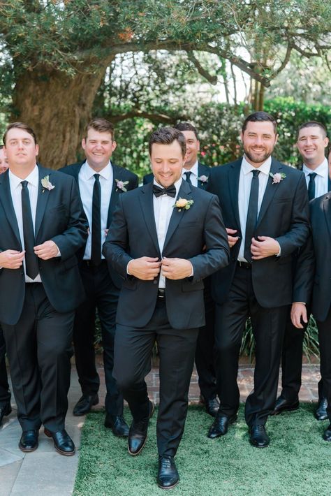 Wedding Groomsmen Black Suit, Black Suit Black Tie Groomsmen, No Tux Wedding Groom Attire, Mens Wedding Suits Black Groom Attire, Groom In Tux Groomsmen In Suits, Groom Tux Groomsmen Suits, Groom And Groomsmen Black Suit, Bridal Party Outfits Groomsmen, How To Make The Groom Stand Out