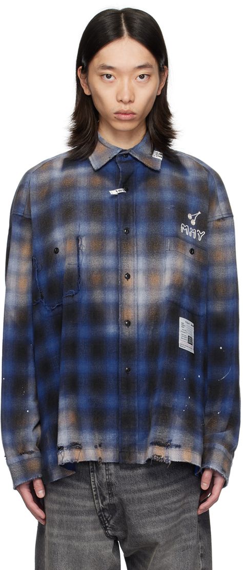 Cotton flannel shirt. Check pattern, fading, distressing, and subtle paint splatters throughout. · Logo patch at spread collar · Logo flag at button closure · Loose thread detailing and embroidered logo graphic at chest · Patch pockets · Logo patch at front · Rips at droptail hem · Vented side seams · Dropped shoulders · Single-button barrel cuffs · Graphic appliqués and embroidered text at back Supplier color: Blue Embroidered Text, Maison Mihara Yasuhiro, Maison Mihara, Patches Shirt, Paint Splatters, Mens Fashion Streetwear, Clothing Mockup, Plaid Design, Blue Check