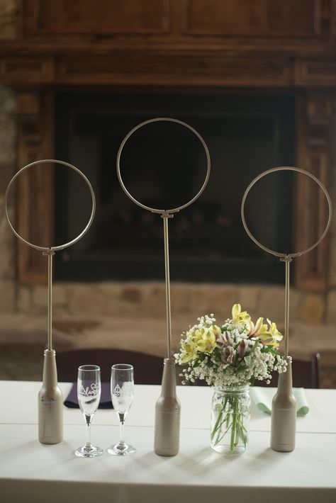 | harry potter wedding decor ideas --- quidditch hoops | rustic wedding decorations | wedding theme ideas --- harry potter | yellow + purple rustic wedding decorations | for couples who love harry potter | wedding reception | photo taken at THE SPRINGS Event Venue. follow this pin to our website for more information, or to book your free tour! SPRINGS location:  The Lodge in Denton, TX photographer:  Kate & Co Photography #rusticwedding #harrypotter #rusticweddingdecor #weddingreception #wedding Harry Potter Wedding Reception, Harry Potter Wedding Decor, Black Bedroom Furniture Decor, Harry Potter Decoration, Purple Rustic Wedding, Harry Potter Houses Slytherin, Harry Potter Table, Harry Potter Symbols, Batman Wedding