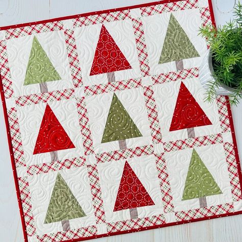 **NEW!!** Tree Mini!! This fun little tree mini will have your halls decked in no time!  Simple to make with traditional piecing.  No templates or special rulers.  I hope you love it! Finished size is 22” x 22”.  Kit includes the backing and can be purchased with or without our newest pattern, Mini Celebrations! It includes five seasonal minis. Paper and PDF patterns available. Tap link in profile to shop or visit our website SweetDaisyQuiltShoppe.com 📷Sweet Daisy Quilt Shoppe . . #... Christmas Quilted Table Runners Patterns, Christmas Tree Quilts, Christmas Present Quilt, Quilts Christmas, Daisy Quilt, Tree Quilt Block, Christmas Table Toppers, Christmas Tree Quilt, Quilted Table Runners Patterns