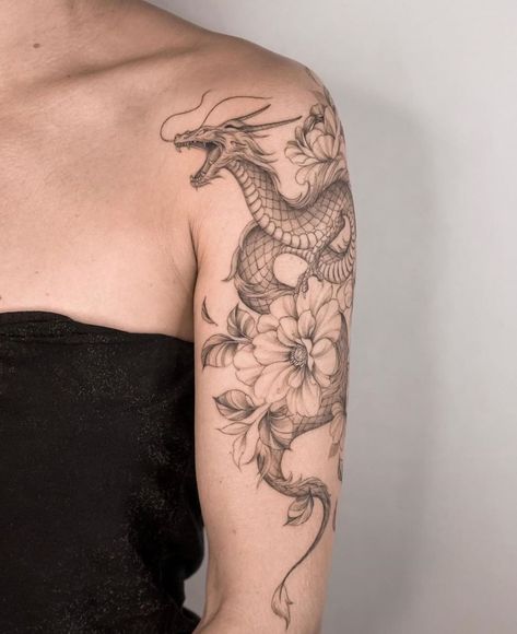 Dragon Tattoo | Tattoo Ideas and Inspiration | miriamandrea_ink Tattoo Brazo Mujer, Tattoo Pequeños Mujer, Dragon Tattoo With Flowers, Dragon Tattoo Shoulder, Bicep Tattoo Women, Black Dragon Tattoo, Dragon Tattoo Arm, Shoulder Sleeve Tattoos, Around Arm Tattoo