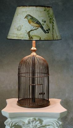 20 Lovely Repurposed Bird Cages | Daily source for inspiration and ...  (darling look, but imagine the dust it would collect) Birdcage Lamp, Cage Table, Bird In A Cage, Unique Table Lamps, Bird Cage Decor, Bird Cages, Bird Decor, Diy Lamp, Diy Lighting