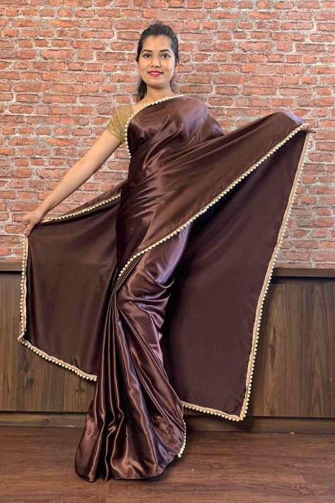 Description Wear it with pearls and beige sandals. Saree Details Saree Border/Pattern Moti Lace border Saree Fabric Poly satin Saree Color Chocolate brown Petticoat Petticoat Attached with "Wrap in 1 Minute" Saree. No need to wear/ purchase petticoat separately. Blouse Details Blouse Available Yes Blouse Fabric Jacquard Blouse Color Gold Blouse Shown in Image Blouse worn by the model is separate. Washing and Care Instructions Dry Clean Only WRAP IN 1 MINUTE SAREE - NO HASSLE of Pleats, Pico, Fal Brown Satin Saree, Moti Lace, 1 Minute Saree, Lace Border Saree, Kashta Saree, Saree Accessories, Blush Prom Dress, Formal Saree, Long Indian Hair