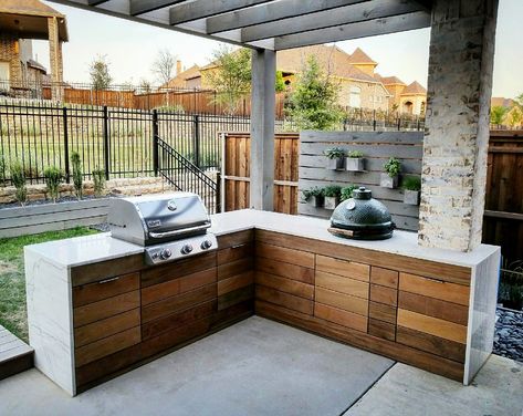 The outdoor kitchen is finally complete. Our contractor did a great job integrating the Weber (which isn’t a true built-in grill) into our contemporary/simplistic design. We used ipe wood on the flush cabinets with Amerock hardware, with calacatta quartzite waterfall counters and a sealed concrete texture on the backside. Ready for summer! Weber Outdoor Kitchen, Flush Cabinets, Calacatta Quartzite, Kamado Table, Amerock Hardware, Man Kitchen, Bbq Station, Used Outdoor Furniture, Outdoor Bbq Area