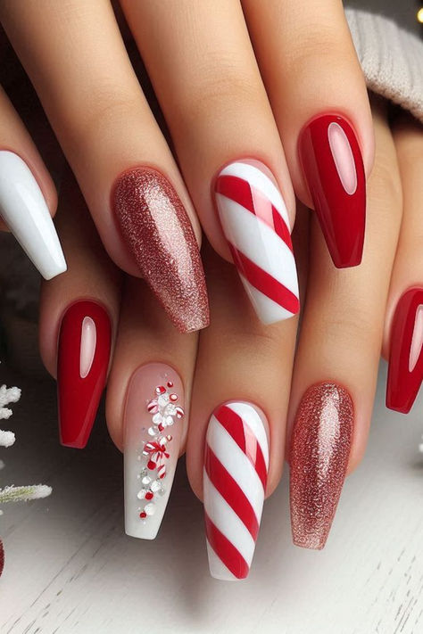 Get inspired with 30 magical Christmas nail designs, from candy canes to glittery snowflakes! Perfect for the holidays. 🎄✨ Christmas Nails 2023 Candy Cane, Candy Cane Striped Nails, Red Christmas Nails Candy Canes, Christmas Nails Stripes, Girlie Christmas Nails, Red Xmas Nails Designs, Red And White Christmas Nail Designs, Classy Christmas Nails Coffin, Christmas Dip Powder Nails Ideas