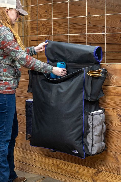 Woman in horse barn stands in front of horse stall front opening the top of a Tough1 Deluxe Stall Front Bag to put away a pair of turquoise sport boots. Horse Blanket Storage Ideas, Horse Blanket Storage, Horse Blankets Storage, Horse Blankets Winter, Winter Horse, Horse Blanket, Trailer Decor, Horse Blankets, Blanket Storage