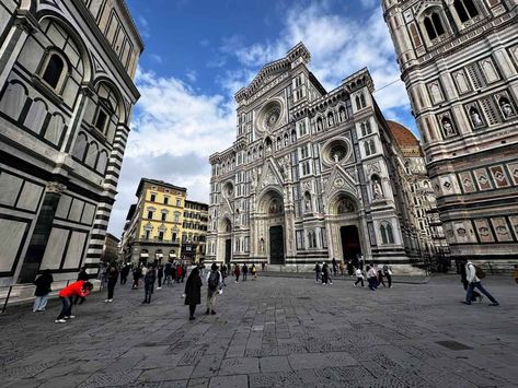 A sunny day in Piazza del Duomo in Florence in January. There are a few people walking in the piazza in front of the Duomo. The dome is peeking out in the background. Things To Do In January, San Miniato, Piazza Del Duomo, Visit Florence, People Walking, Montepulciano, Travel Packing, Sunny Day, Plan Your Trip