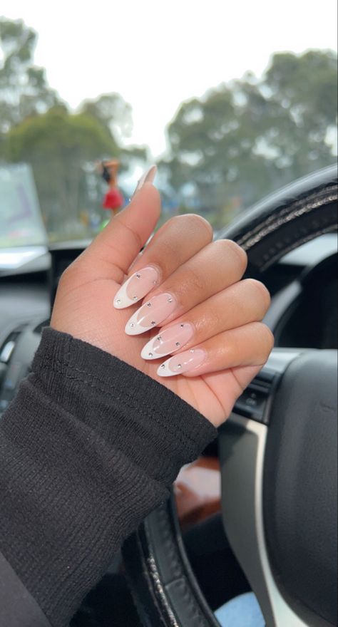 Almond Nails French Tip With Diamond, French Nail Designs Rhinestones, Almond French With Rhinestones, Almond Nails French Tip With Gems, Simple Almond Nails With Gems, Acrylic French Design, French Mani With Gems, White Almond French Tip Nails With Gems, Mails With Diamond