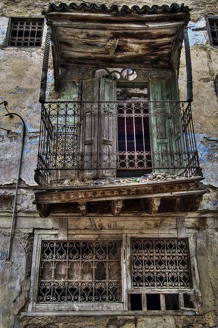 Balcony in old Jewish section of Fez. Fez (Fes) is the medieval capital of Morocco founded by Idris I in 789, and a great city of high Islamic civilization. Fez has the best preserved old city in the Arab world, the sprawling, labyrinthine medina of Fes el-Bali, which is incidentally also the world's largest car-free urban zone. Old Balcony, Urban Zone, Islamic Civilization, Derelict Buildings, Iron Balcony, Odessa Ukraine, Abandoned Mansions, Haunted Places, Abandoned Buildings