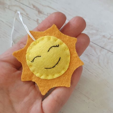 ☀️ Brighten up your day with this little ball of sunshine! 🌞 Yep, you guessed it right - I whipped up this adorable felt sun ornament all by myself, and let me tell you, it's got more personality than your average ray of sunshine! 😄 Imagine waking up to this cheery face hanging on your Christmas tree or adorning your little one's bedroom - instant mood lift guaranteed! Plus, it's handmade with love and bursting with charm, just like you! 💖 So, if you're ready to add some sunny vibes to your... Felt Sun, Desert Habitat, Sun Ornament, Desert Christmas, Sunny Vibes, All By Myself, Ray Of Sunshine, Felt Toys, Felt Fabric