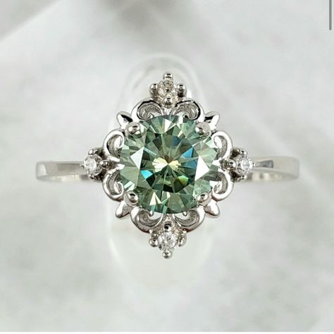 Stunning 6.5mm, 1ct Green Moissanite Victorian Style Solid Sterling Silver Ring, Stamped S925 Is Handmade & One Of A Kind. Features 1ct, 6.5mm D Color (Green) Excellent Round Cut Vvs1 Clarity Solid Sterling Silver Setting S925 Gra Certificate Included Checkout My Matching Earrings Available On My Page And Make It A Set, Sold Separately. Antique Silver Rings For Women, Emerald Engagement Ring Vintage Unique, Mass Agate Engagement Ring, Pretty Silver Engagement Rings, Silver And Emerald Ring, Emerald Wedding Rings Silver, Green And Silver Engagement Ring, Green Saphire Ring, Green Sapphire Engagement Ring Silver