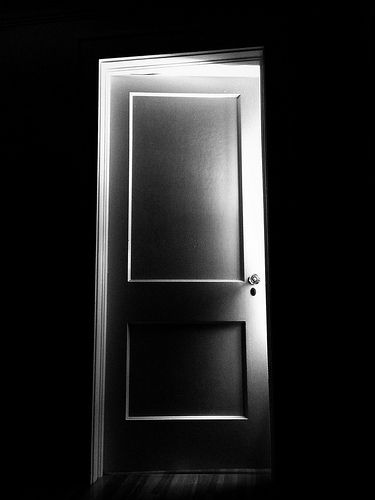 The door at the end of the hall Light Through Open Door, Mysterious Door Aesthetic, A Door In The Dark Book, Door Black And White, Scary Door, Dark Room Developing Film, Open Door Photography, Black And White Door, Private Person