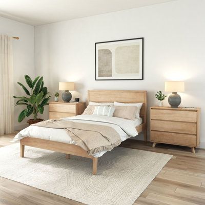 With its minimal design and low-profile silhouette, this platform bed brings modern elegance to your sleep space. It's made from solid and engineered wood, and it rests on sleek, tapered legs that keep sightlines clear. We love that the rectangular panel headboard showcases a slatted design for plenty of contrast, while the footboard makes sure your blankets stay off the floor. There's also room underneath to tuck away boxes and bins for out-of-sight storage. Best of all, a box spring isn't requ Blonde Queen, Wood Panel Bed, Lit King Size, Bed Queen, Solid Wood Platform Bed, Wood Bed Frame, King Bed Frame, Queen Bed Frame, Wooden Bed Frames