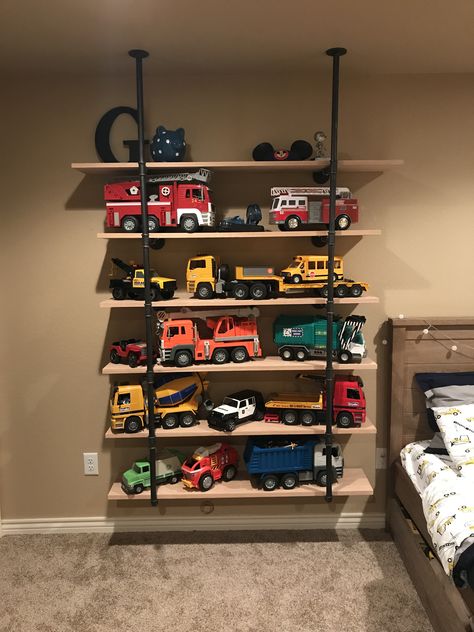 Truck storage bruder trucks shelves toy storage boy room boys Boy Toy Storage, Toy Organization Diy, Diy Toy Storage, Big Boy Bedrooms, Toddler Boys Room, Toddler Rooms, Toddler Bedrooms, Toy Rooms, Big Boy Room