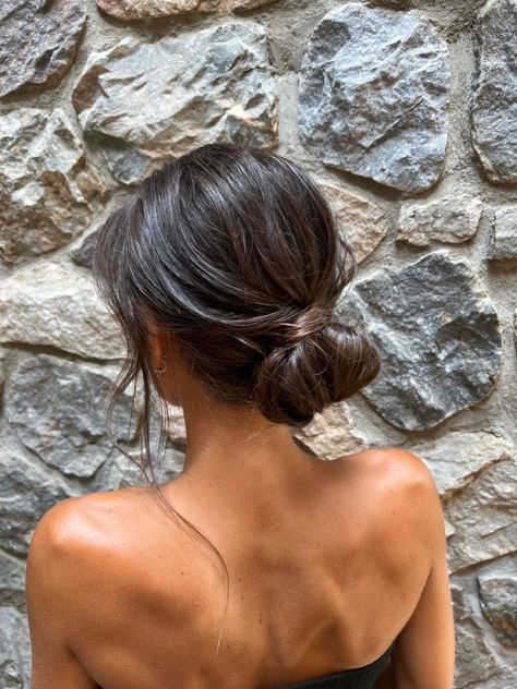 Prom Simple Updos, Dark Hair Low Bun, Undone Bun Wedding, Simple Bun Hairstyles Wedding, Prom Updos Simple, Brunette Hairstyles Prom, Effortless Bun Hairstyles, Low Messy Bun Brown Hair, Minimalist Bridesmaid Hair