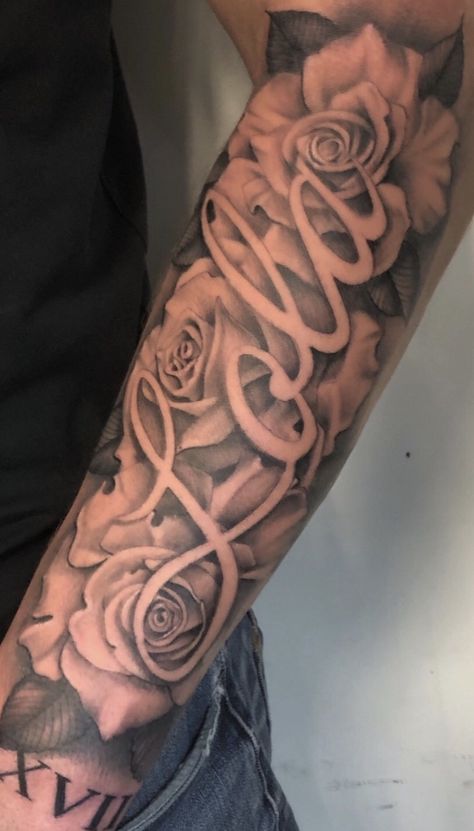 Name Tattoo On Inside Of Arm, Name Tattoo With Roses Forearm, Negative Space Name Tattoo, Names With Roses Tattoos, Her Name Tattooed On Him, Name Tattoos Sleeve, Big Name Tattoos On Arm, Sleeve Tattoo For My Daughter, Name On Hip Tattoo