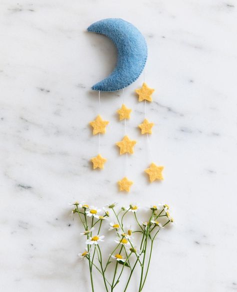 Dreaming under the stars? Yes, please! We love our new Stardust Moon wall hanging - bringing the moon and twinkling stars into your home… Felt Moon And Stars, Needle Felted Moon, Lovers Of The Moon, Felt Moon, Apartment Nursery, Moon Ornament, Felt Animal Patterns, Baby Nurseries, Felt Mobile