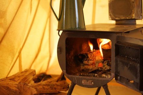 Using a wood burning stove inside your tent is a great way to stay warm and dry during winter camping expeditions. Read my tips on doing this safely! Tent Wood Stove, Diy Wood Burning, Wood Stove Wall, Best Tent, Camping Wood Stove, Diy Wood Stove, Canvas Bell Tent, Cozy Camping, Tent Living