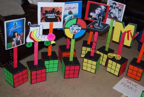 80's centerpieces 90s Centerpieces Diy, 80s Centerpieces Diy Table Decorations, 80s Table Centerpieces, 80’s Centerpieces, 80s Centerpieces, Youtube Birthday, 90s Party Ideas, Decades Party, Moms 60th