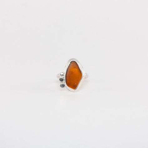 Bring a touch of the ocean to your look with the Amber Sea Glass Ring. Made with Mendocino County sea glass and sterling silver, this nature-inspired ring is perfect for any beach lover. Feel connected to the sea wherever you go with this beautiful and unique piece of jewelry. Mendocino Sea Glass Sterling Silver Size : 8 1/2 Silver Ring Stone, Seaglass Rings, Sea Glass Rings, Silversmith Rings, Iconic Jewelry, Diy Silver Jewelry, Dope Jewelry Accessories, Sea Glass Ring, Jewelry Tattoo