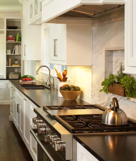 Fresh herbs tucked in the slab backsplash behind the Wolf range. Shelf Behind Stove, Granite Shelf, Slab Backsplash, Foyer Stairs, Wolf Range, Shelf Insert, Cottage Kitchen, Custom Cabinetry, The Wolf