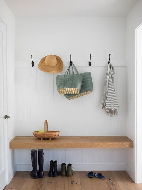 Simple, rustic with a farmhouse touch, this cottage mudroom is completed with an oak block floating bench on a white vertical shiplap wall under oil rubbed bronze hooks. Entry Way Modern Farmhouse Ideas, Scandi Entryway, Cottage Mudroom, Scandi Hallway, Entry Nook, Cottage Laundry Room, Vstupná Hala, Farmhouse Mudroom, House Flip