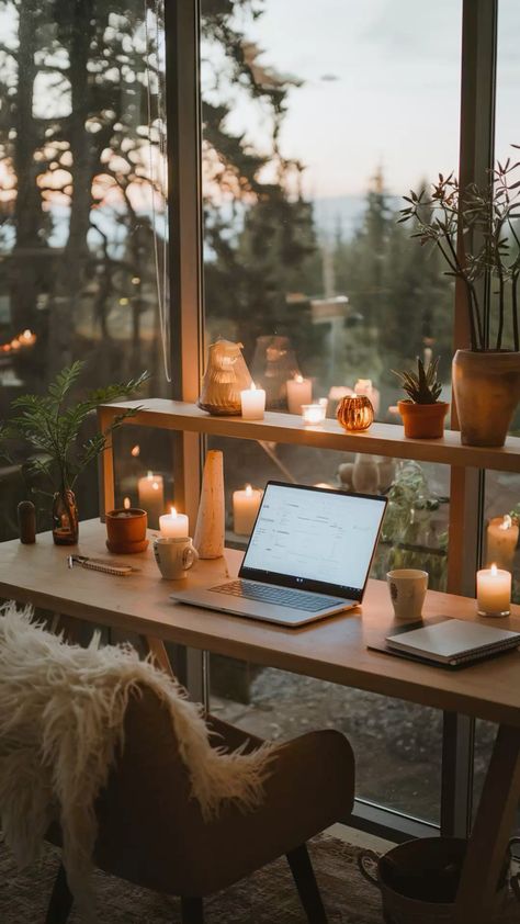 Create the perfect warm and cozy workspace with soft candlelight, a wooden desk, and a breathtaking forest view. This minimalist and aesthetic home office setup features natural elements, warm lighting, and a peaceful ambiance—ideal for work, study, or journaling. Get inspired to design your own hygge-inspired workspace with plants, warm decor, and cozy vibes! #CozyWorkspace #HomeOfficeIdeas #AestheticDesk #WarmLighting #natureview Warmth Aesthetic, Aesthetic Workspace, Aesthetic Home Office, Cozy Workspace, Warm Decor, Forest View, Warm Lighting, Work Study, Nature View