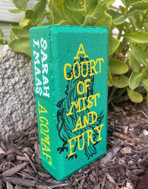 This is a hand painted brick featuring A Court of Mist and Fury by Sarah J. Maas. All sides are painted and sealed with gloss sealant to help preserve art. Please keep in mind that some of the surfaces are very porous. There are brick lines under the paint. Brick Painted As Books, Painted Brick Books, Book Bricks, Painting Bricks, Brick Books, Painted Bricks Crafts, Brick Painting, Painted Bricks, Brick Crafts