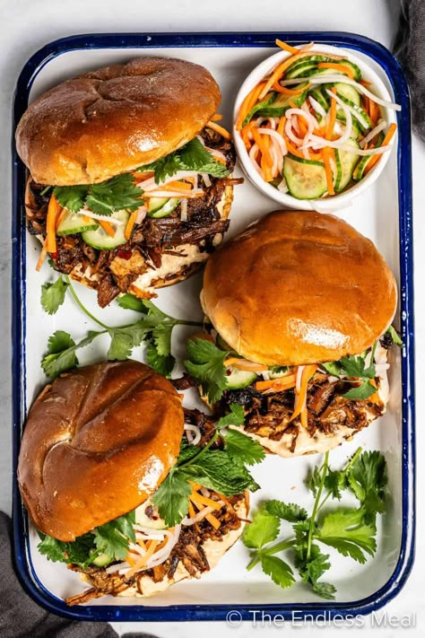 Take your sandwich game to the next level with a Korean twist, with this flavor-packed Korean pulled pork sandwich. Slather some creamy, tangy kimchi mayo on buttery brioche, then load it up with tender pork slow-cooked to perfection in flavorful gochujang. Topped it off with pickled veggies and vibrant herbs - it's perfect for when you're craving something hearty yet fresh! #theendlessmeal #pulledporksandwich #pulledpork #sandwich #koreansandwich #koreanpork Korean Pulled Pork, Kimchi Mayo, Korean Pork, Sandwich Wrap, Gluten Free Buns, Honey And Soy Sauce, Pork Sandwich, Pickled Veggies, Pulled Pork Sandwich